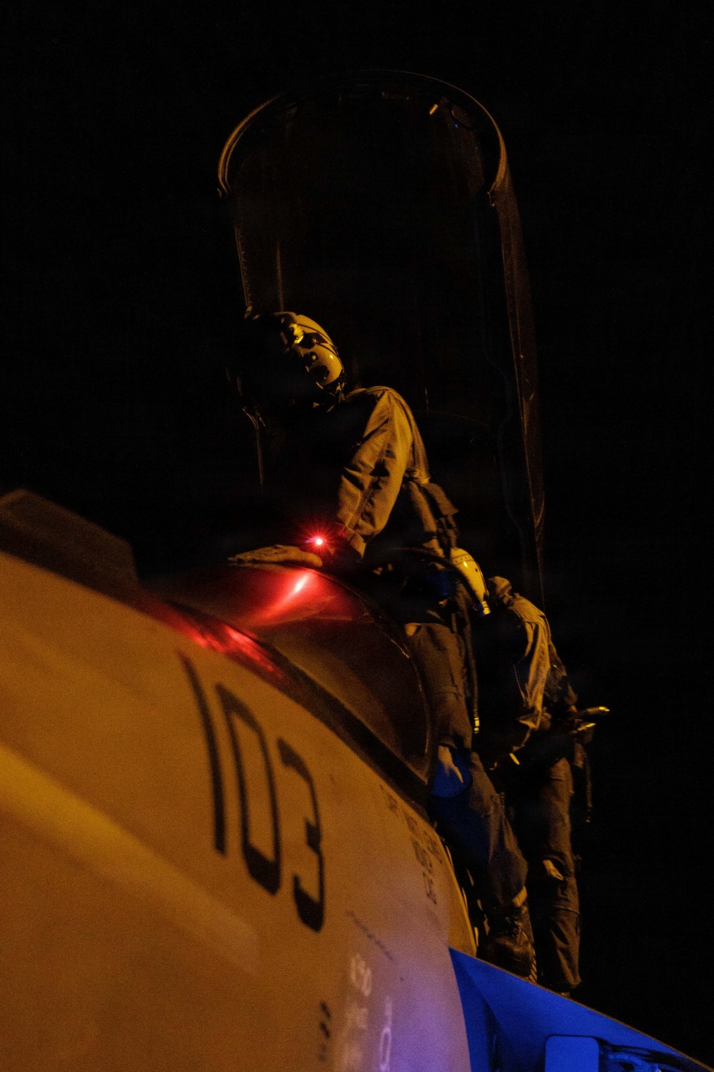 USS George H.W. Bush Sailors inspect an F/A-18E Super Hornet