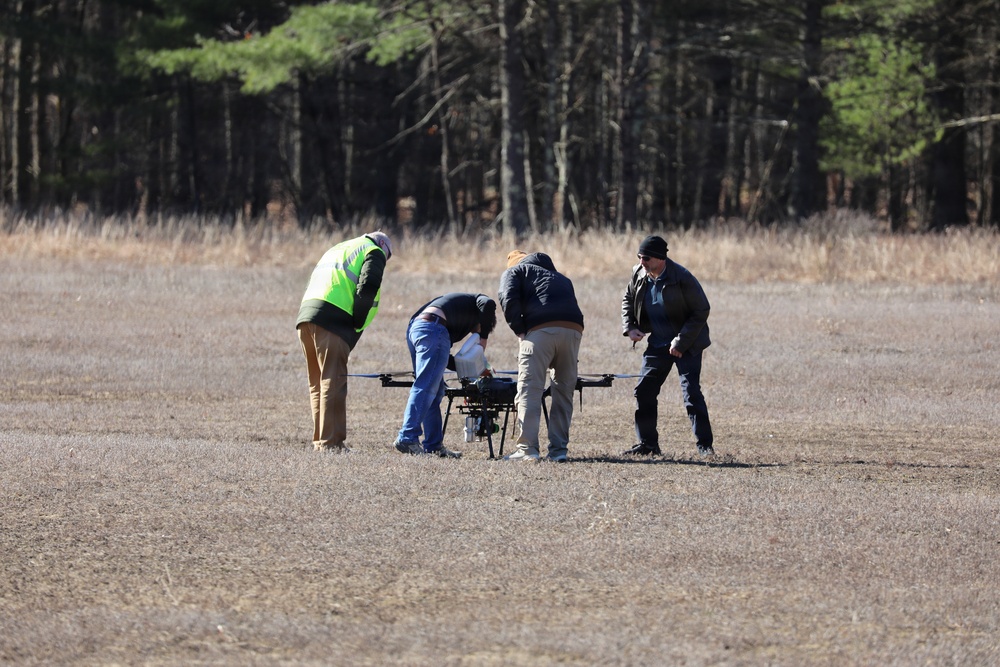 Technicians Prepare Large Multi-Rotor Drone for Flight Operations at Open Field Test Site