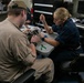 Midshipmen participate in maintenance aboard USS Arlington (LPD 24)