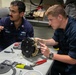 Midshipman participate in maintenance aboard USS Arlington (LPD 24)