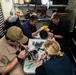 Midshipman participate in maintenance aboard USS Arlington (LPD 24)
