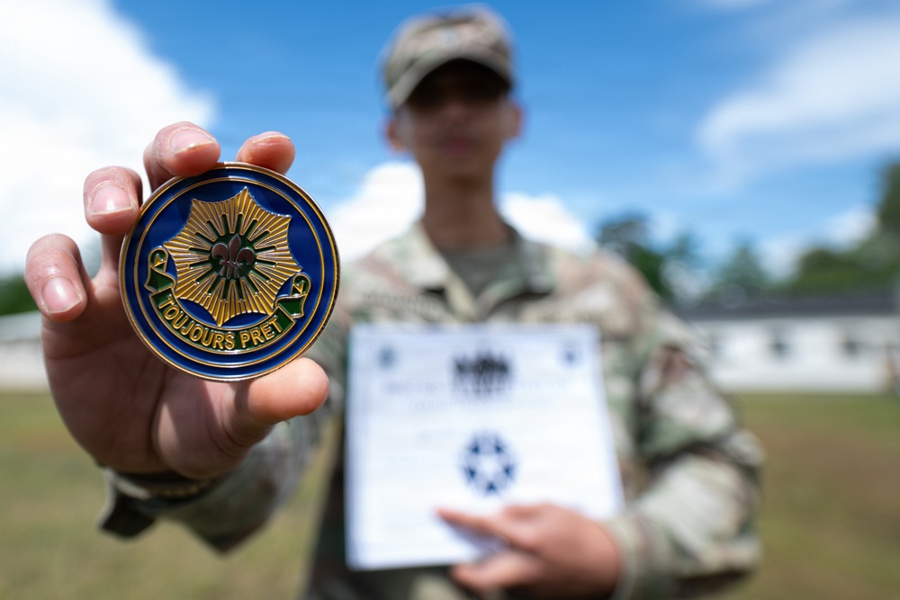 Spc.  Gagante Poses with Command Coin