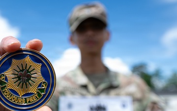 Spc.  Gagante Poses with Command Coin
