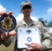 Spc.  Gagante Poses with Command Coin
