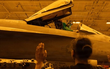 USS George H.W. Bush inspects an F/A-18E Super Hornet