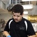 USS George H.W. Bush Sailor chops lettuce