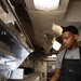 USS George H.W. Bush Sailor prepares food