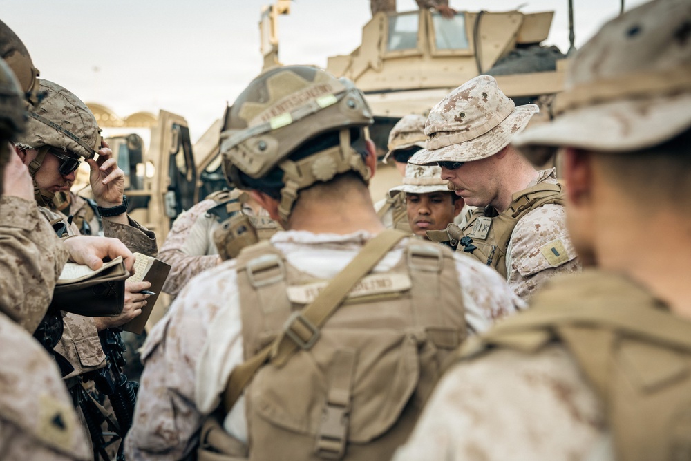 U.S. Marines and Sailors Depart to a Position Area for Artillery