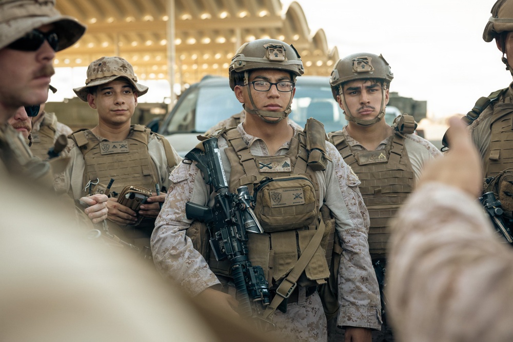 U.S. Marines and Sailors Depart to a Position Area for Artillery