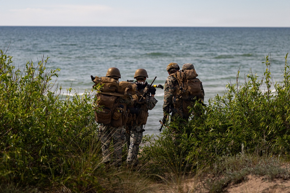 U.S. Marine Corps combat engineers conduct beach security patrol