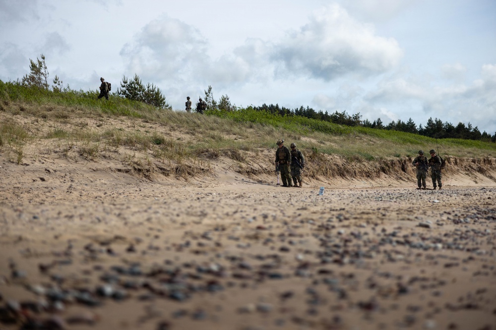 U.S. Marine Corps combat engineers conduct beach security patrol