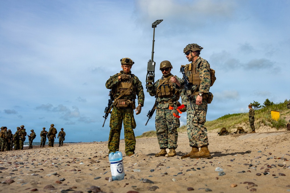 U.S. Marine Corps combat engineers conduct beach security patrol