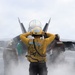 USS George H.W. Bush signals a F/A-18E Super Hornet