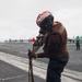 USS George H.W. Bush chains down an MH-60R Sea Hawk