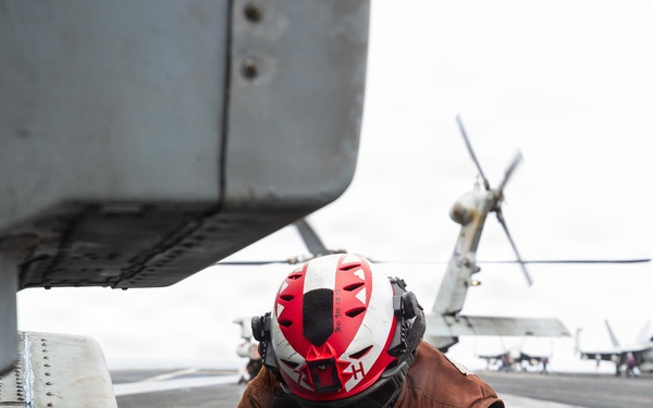 USS George H.W. Bush chains down an MH-60R Sea Hawk