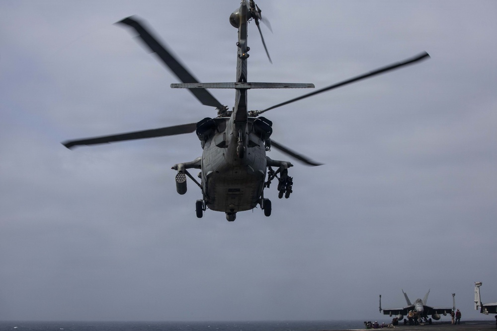 USS George H.W. Bush launches a MH-60S Sea Hawk