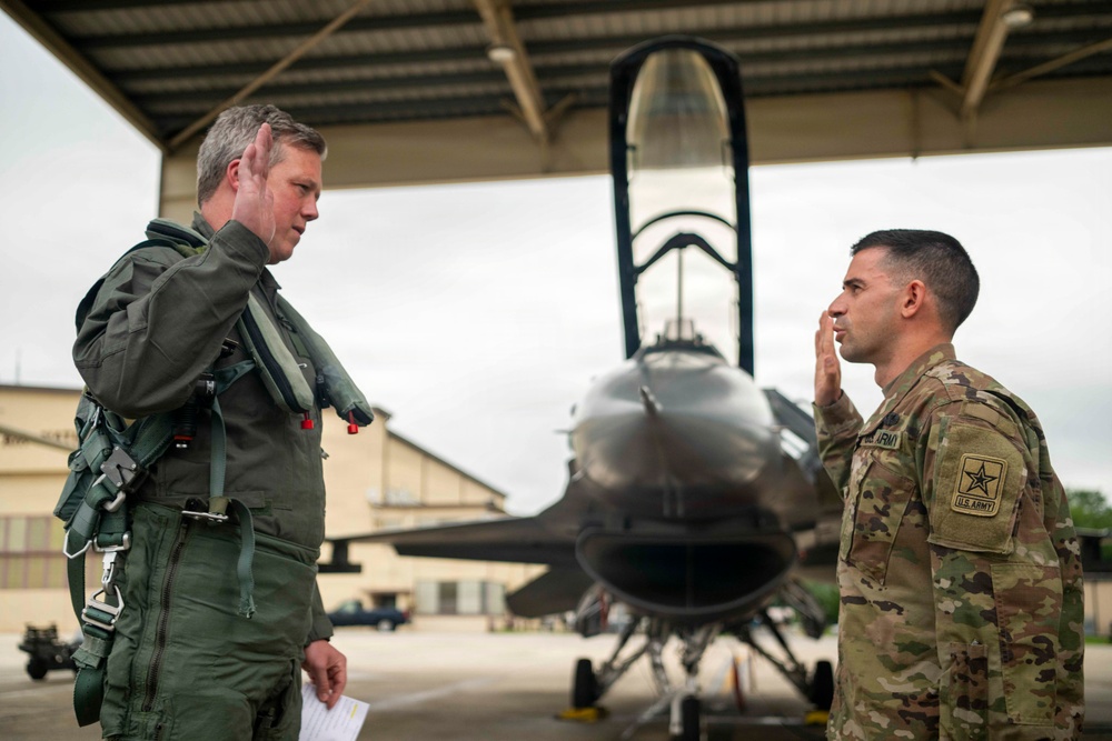 Secretary of the Army, Hon. Dan Driscoll, re-enlists Soldier.