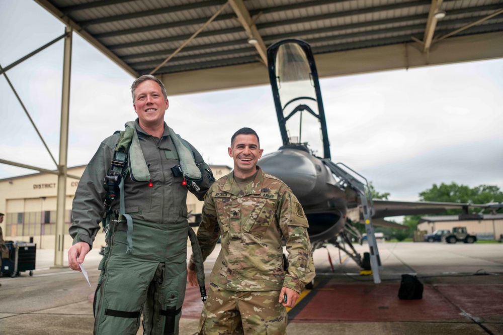 Secretary of the Army, Hon. Dan Driscoll, re-enlists Soldier.
