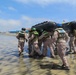 2nd Bn., 5th Marines, paddle through surf during infantry company small boat raid course