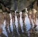 2nd Bn., 5th Marines, paddle through surf during infantry company small boat raid course