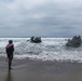 2nd Bn., 5th Marines, paddle through surf during infantry company small boat raid course