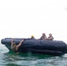 2nd Bn., 5th Marines, paddle through surf during infantry company small boat raid course
