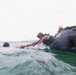 2nd Bn., 5th Marines, paddle through surf during infantry company small boat raid course
