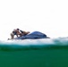 2nd Bn., 5th Marines, paddle through surf during infantry company small boat raid course
