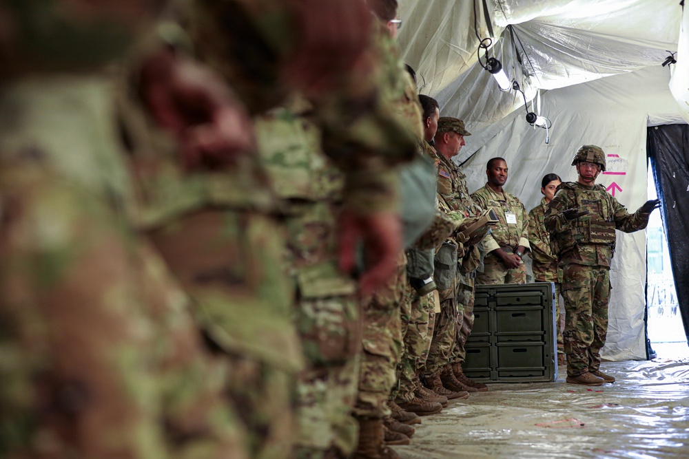 Generals, Distinguished Guests, and International Partners Tour Field Hospital During Operation Sentinel Justice