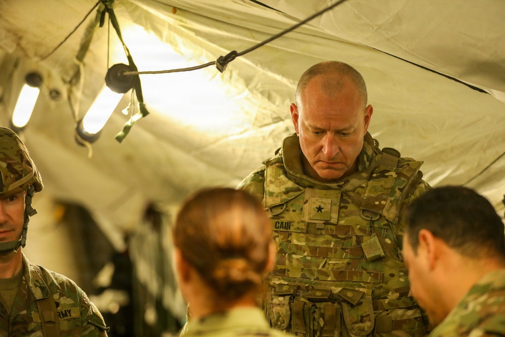 Generals, Distinguished Guests, and International Partners Tour Field Hospital During Operation Sentinel Justice