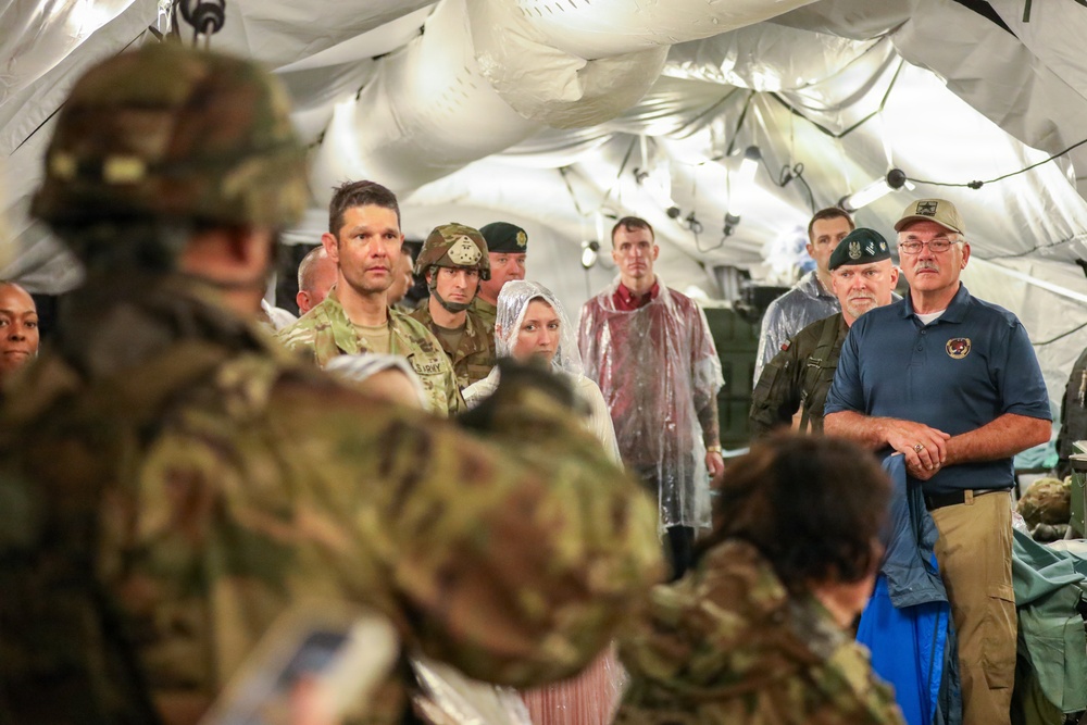 Generals, Distinguished Guests, and International Partners Tour Field Hospital During Operation Sentinel Justice