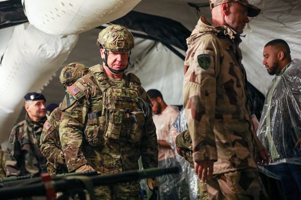 Generals, Distinguished Guests, and International Partners Tour Field Hospital During Operation Sentinel Justice