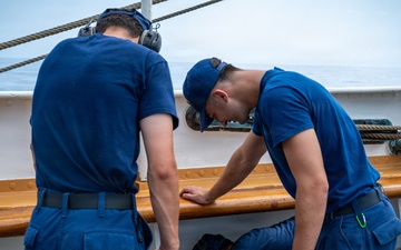 U.S. Coast Guard Academy cadets beautify the decks of the Cutter Eagle (WIX-327)