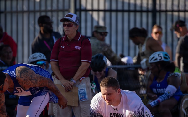 Army and Air Force Athletes Prepare at Starting Blocks During Track Competition