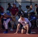 Army and Air Force Athletes Prepare at Starting Blocks During Track Competition