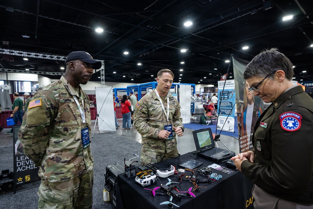 Brig. Gen. Sara Dudley speaks to U.S Army Drone Team officer in charge and noncommission officer in charge at SkillsUSA 2026