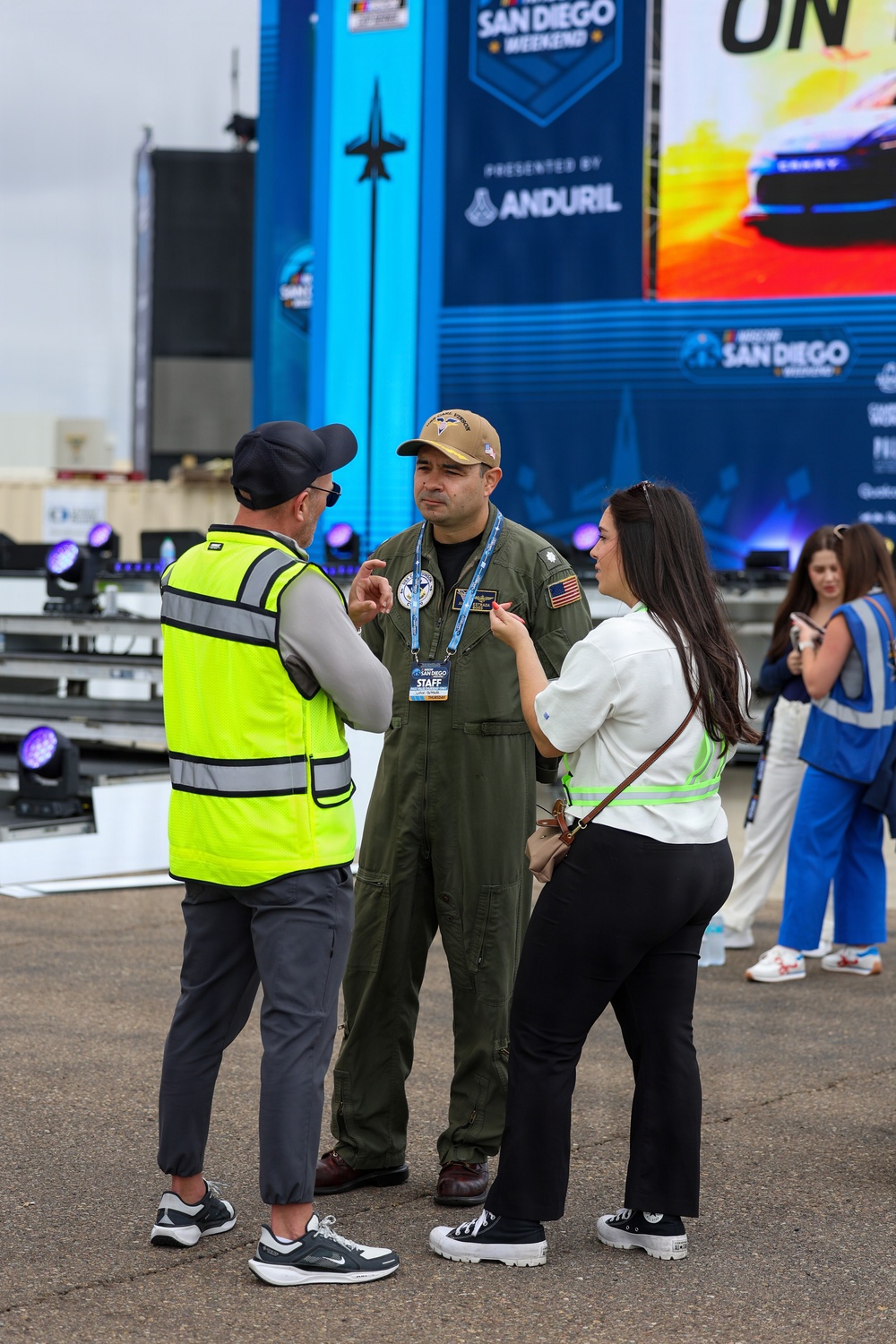 U.S. Navy Cmdr. speaks With attendees at NASCAR San Diego Weekend