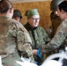 Soldiers treat simulated casualty