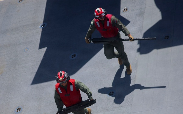U.S. Marines and Sailors conduct flight operations on USS Essex