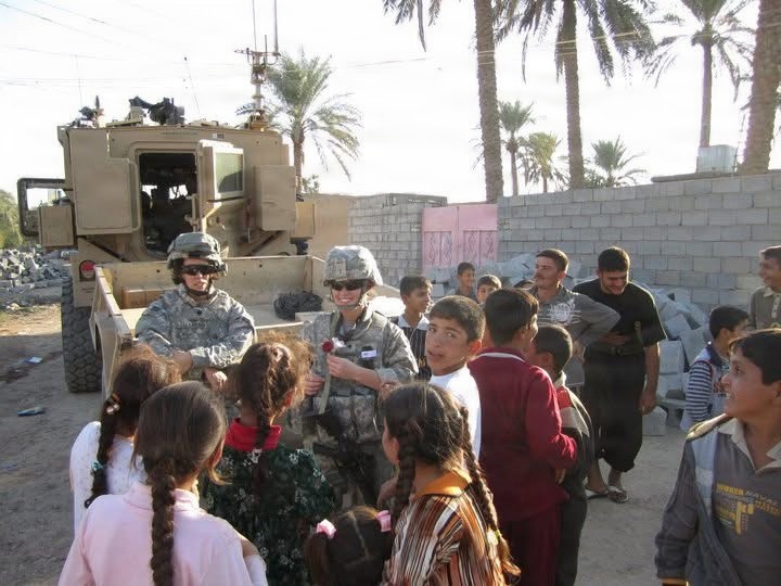 U.S. Army Spc. Selena Holleman with the 163rd Area Support Medical Company, during a medical mission for the civilian population in Baqubah, Iraq, 2010.
