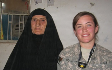 U.S. Army Spc. Selena Holleman with the 163rd Area Support Medical Company, during an examination for the civilian female population in Baqubah, Iraq, 2010.