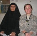 U.S. Army Spc. Selena Holleman with the 163rd Area Support Medical Company, during an examination for the civilian female population in Baqubah, Iraq, 2010.