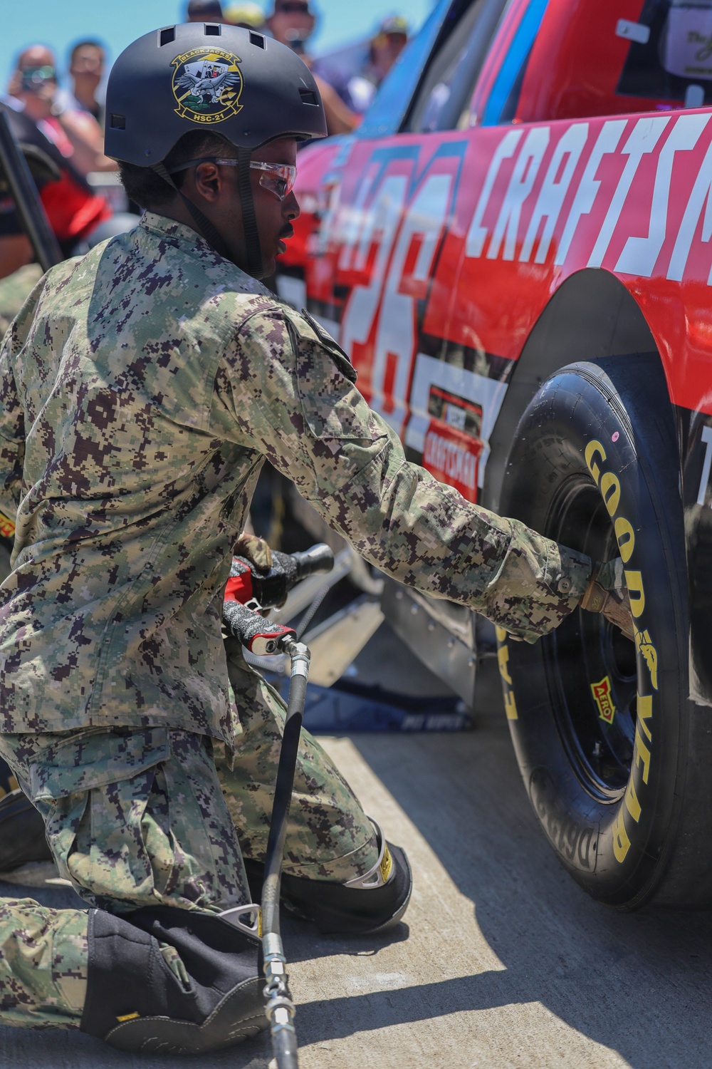 Sailors compete in the NASCAR Pit Crew Challenge