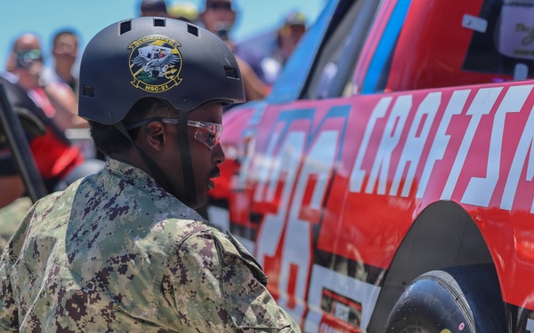 Sailors compete in the NASCAR Pit Crew Challenge