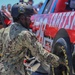 Sailors compete in the NASCAR Pit Crew Challenge