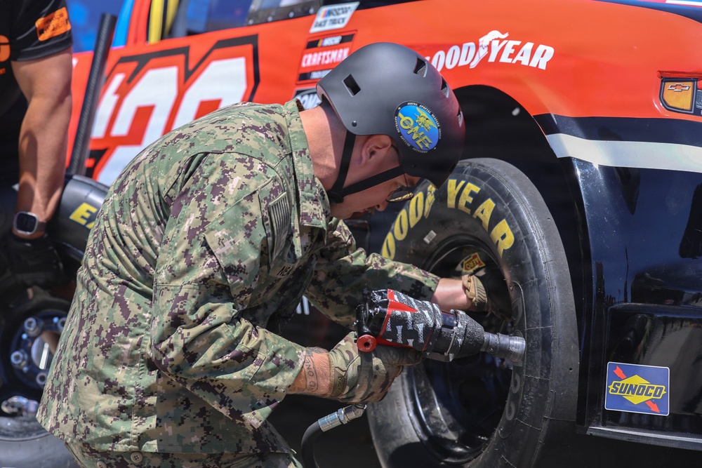 Sailors compete in the NASCAR Pit Crew Challenge