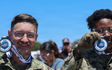 Sailors compete in the NASCAR Pit Crew Challenge