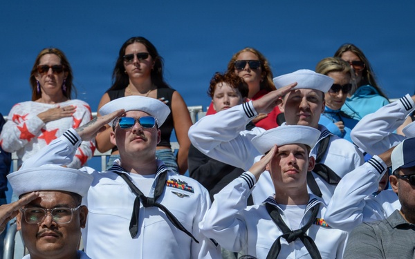 USS Carl Vinson (CVN 70) Sailors observe the national anthem during NASCAR San Diego Weekend