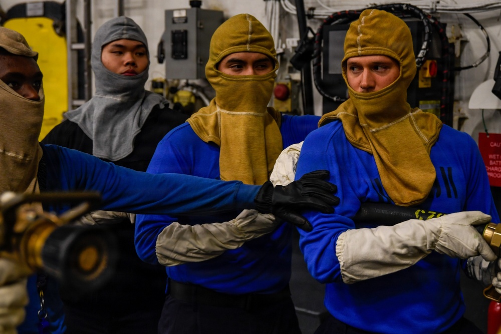 U.S. Navy Sailors Participate in a General Quarters Drill