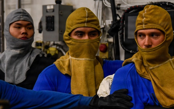 U.S. Navy Sailors Participate in a General Quarters Drill